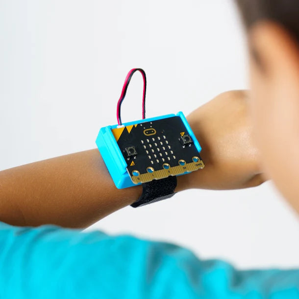 Student wearing CHARGE for micro:bit on his wrist