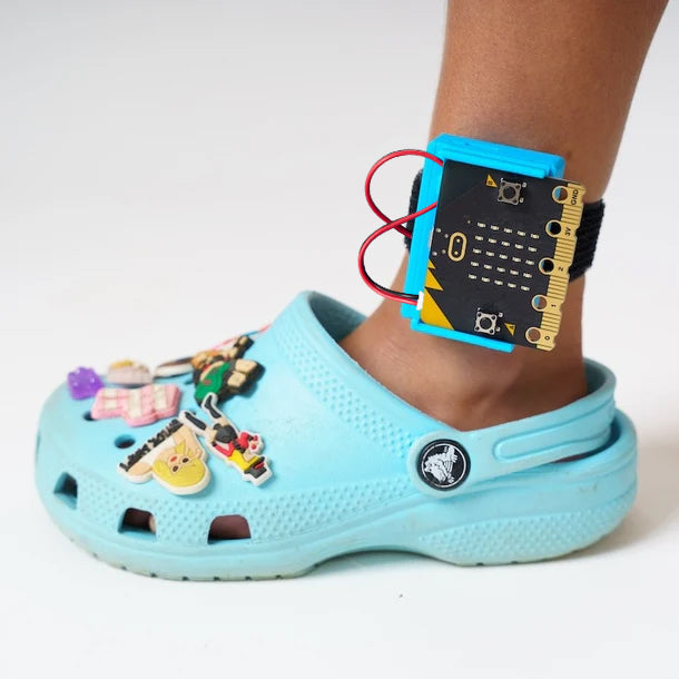 Student wearing CHARGE for micro:bit on their ankle