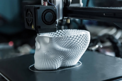 3D Printer printing a white skull