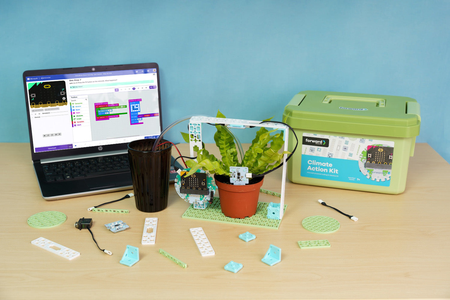 Climate Action Kit Smart Farming project accompanies with laptop showing micro:bit makecode block coding